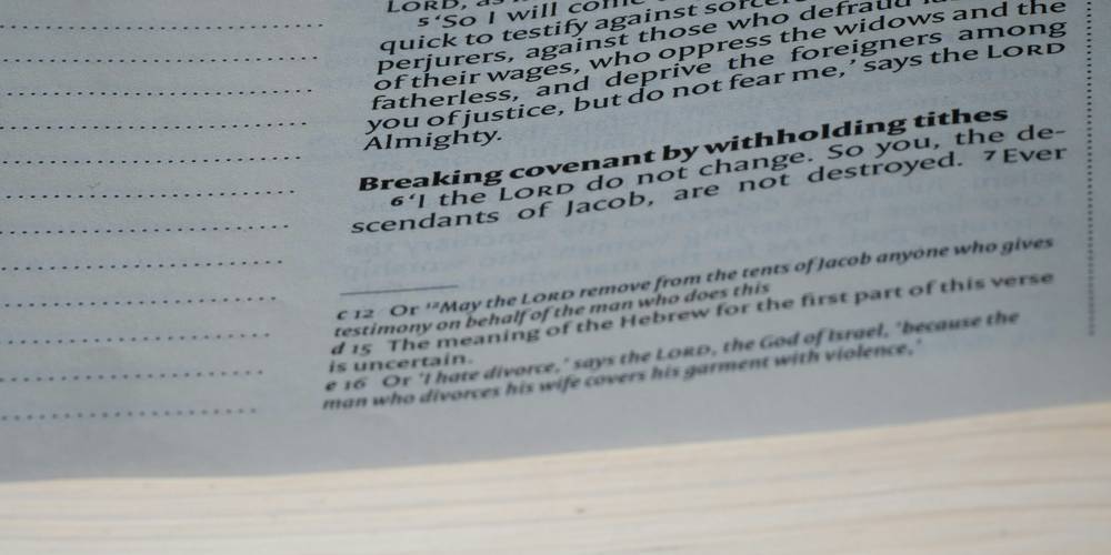 Stack of juror excusal letters beside a courthouse information brochure