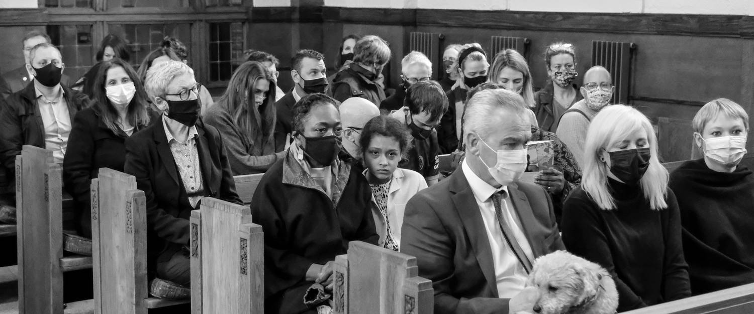 Citizens seated in a traditional Ontario courtroom jury box preparing to take the oath