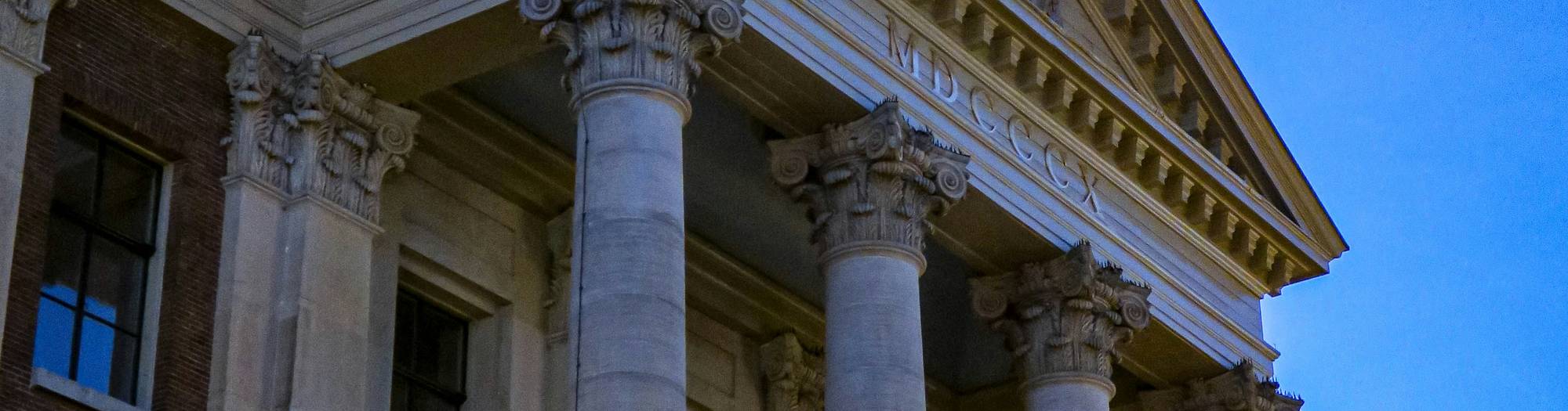 Ontario courthouse façade at dusk symbolising access to legal aid